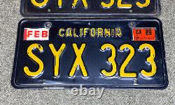 1963 California license plate pair SYX 323 yellow on black embossed 1963