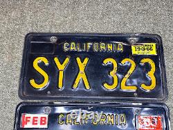 1963 California license plate pair SYX 323 yellow on black embossed 1963