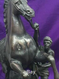 A pair of bronze marley Horses over signed Coustou circa 1900