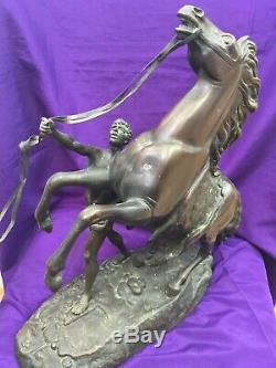 A pair of bronze marley Horses over signed Coustou circa 1900