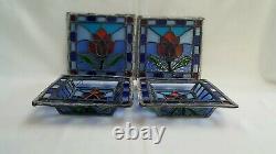 A vintage signed set of four stained glass panels, 1 pair are three dimensional