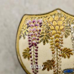 Antique Meiji-period Japanese Satsuma painted Wisteria floral buckle pair signed