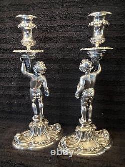 Buccellati style pair of silver candlesticks of putti holding cornucopia signed