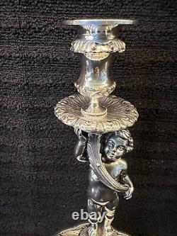 Buccellati style pair of silver candlesticks of putti holding cornucopia signed