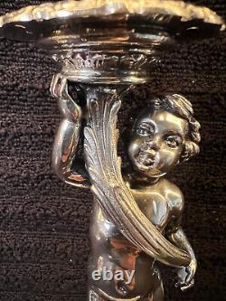 Buccellati style pair of silver candlesticks of putti holding cornucopia signed