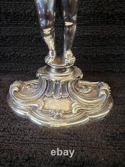 Buccellati style pair of silver candlesticks of putti holding cornucopia signed