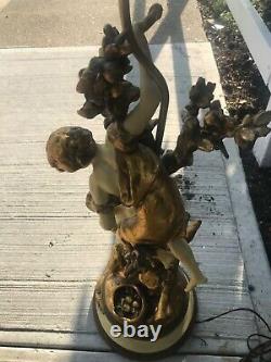 Large pair of spelter lamps, art nouveau figures on a tree signed Moreau