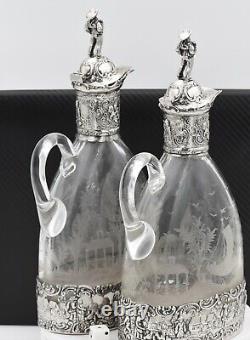 Pair Antique Claret Jugs, signed, circa 19th century with sailor finals