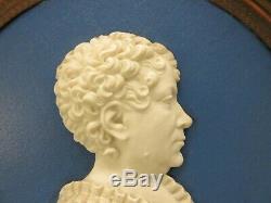 Pair of Georgian signed porcelain silhouette cameo portrait plaques dated 1817