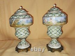 Pair of Sevres Lidded urns Hand painted, artist signed