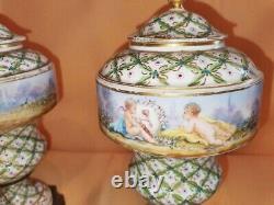 Pair of Sevres Lidded urns Hand painted, artist signed