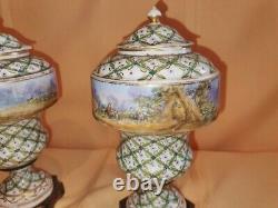 Pair of Sevres Lidded urns Hand painted, artist signed