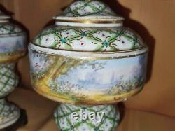 Pair of Sevres Lidded urns Hand painted, artist signed