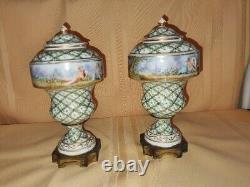 Pair of Sevres Lidded urns Hand painted, artist signed