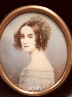Pair of antique miniature portrait paintings of a young lady & young man