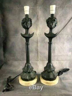 Pair of bronze laps signed by Giacometti